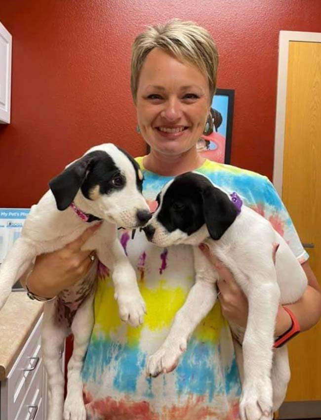 two dogs and their parent in Hobbs, NM | Double J Animal Hospital